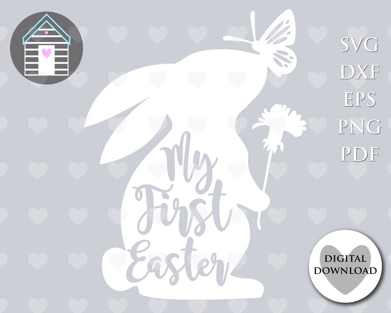 May include: White silhouette of a bunny rabbit with a butterfly on its head and a flower in its paw. The bunny has the text "My First Easter" written on its body.