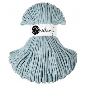 May include: A skein of light blue cotton rope, also known as macrame cord, with the brand name "Bobbiny" printed on a white label.