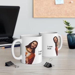 May include: Two white ceramic mugs with a humorous image of Jesus looking over his shoulder and the text "I saw that".