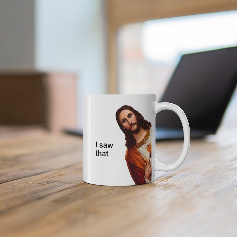 May include: White ceramic mug with a picture of Jesus on it. The mug has the text "I saw that" printed on it.