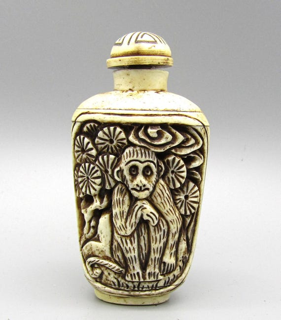 Vintage Chinese Carved Snuff Bottle with Monkey Motif