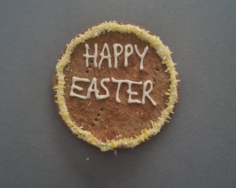 Large Easter cookie. Iced dog treats. Peanut butter cookie. Happy Easter biscuits for dogs.