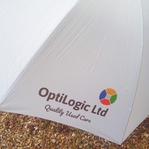 White golf umbrella custom printed company logo in full colour.