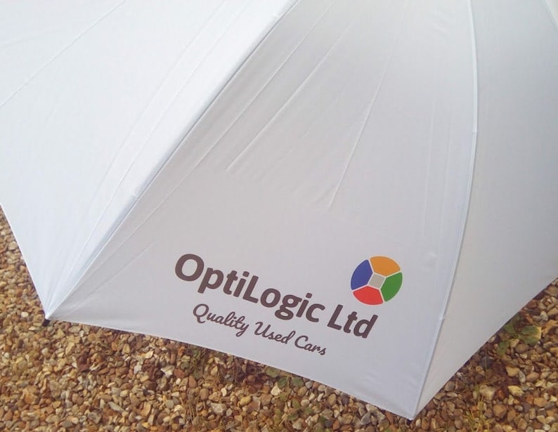 White golf umbrella custom printed company logo in full colour.