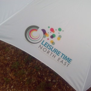 Full colour printing on a white golf umbrella with no minimum order.
