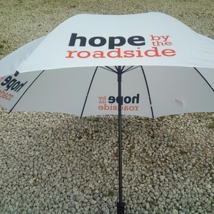 Promotional golf umbrella printed on all four panels with logo