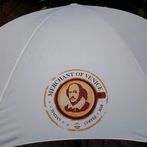 Customised golf umbrella in white branded with corporate logo