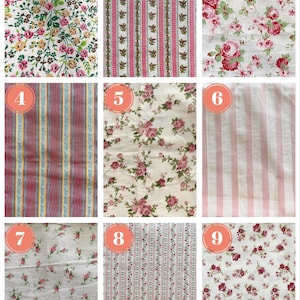 May include: Nine fabric swatches with floral and striped patterns. The fabrics feature various designs, including small flowers, roses, and vertical stripes in colors like pink, red, and white. These fabrics are suitable for sewing and crafting projects.