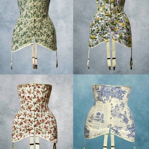 May include: Four corsets with suspenders are displayed. The corsets feature various floral patterns in green, yellow, red, and blue. One corset has a toile design. The corsets have a boned structure and are made of fabric.