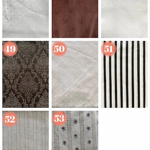May include: A collection of fabric swatches with various patterns and textures. Includes white fabrics with polka dots and diamond patterns, a brown floral fabric, a black and white striped fabric, and a brown damask pattern.