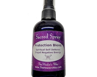 Pode incluir: Uma garrafa roxa com um borrifador preto etiquetado "Sacred Spray Protection Blend Spiritual Self Defense Dispel Negative Energy The Healer's Way www.TheHealersWay.com"