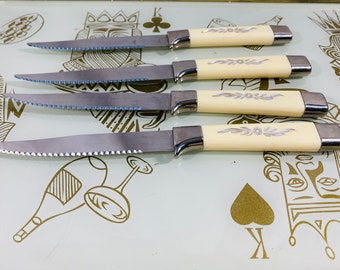Vintage set of six stainless steel and plastic steak knives with rippled edge - Emdeco Sheffield  set of four knives