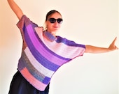 Fashionable crocheted asymmetric lilac pullover. Striped women 39 s warm tunic. Sweater with oblique purple and pink stripes.