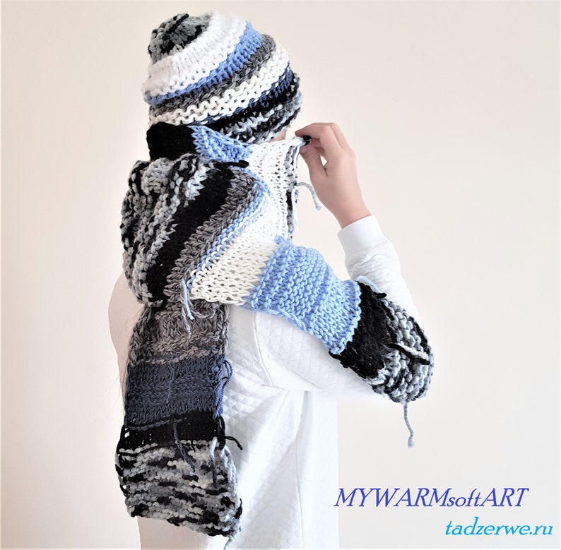 striped Knitted \u0440attern Hippie Set: A long White-blue- black scarf and hat. hand-knitted scarf and a striped hat with a fringe