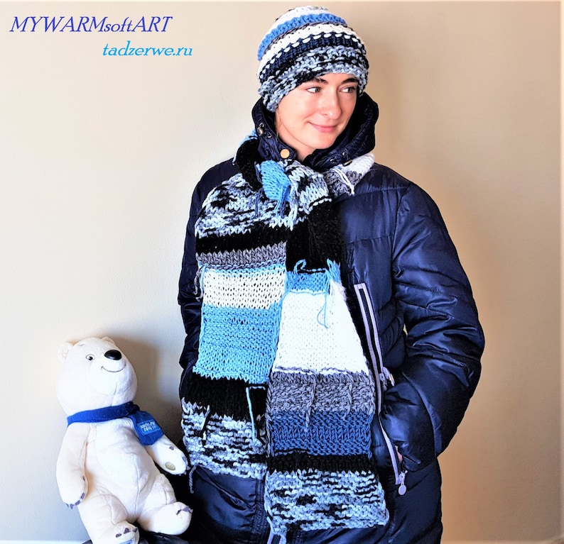striped Knitted \u0440attern Hippie Set: A long White-blue- black scarf and hat. hand-knitted scarf and a striped hat with a fringe