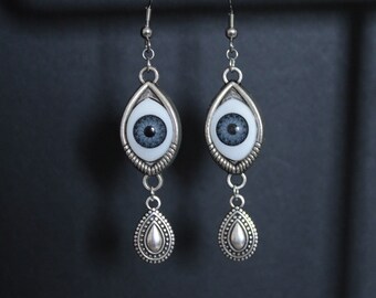 silver earrings with eye and dangle