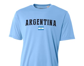 May include: Light blue t-shirt with the word "ARGENTINA" printed in black letters and the Argentine flag in the center.