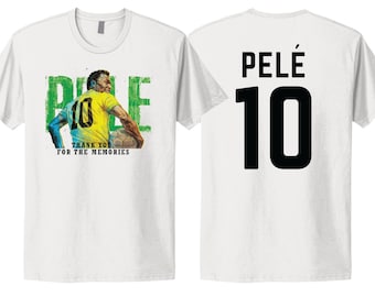 May include: Two white t-shirts, one with a graphic of soccer player Pelé and the text "Pelé Thank You For The Memories", and the other with the text "Pelé 10".