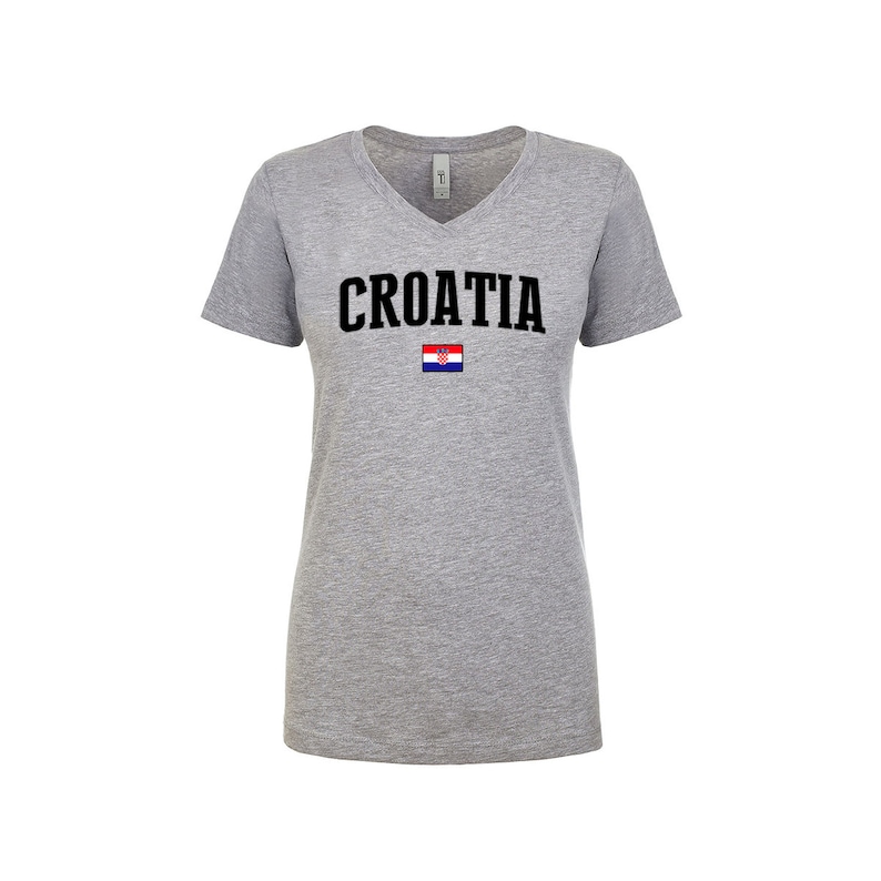 May include: A heather gray V-neck t-shirt with the word "CROATIA" printed in black on the front. The Croatian flag is printed below the word.