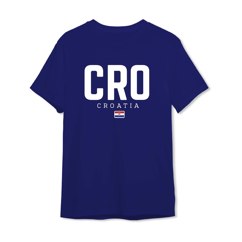 May include: A navy blue t-shirt with the word "CRO" in white letters and the word "CROATIA" in smaller white letters below. A small Croatian flag is below the word "CROATIA".