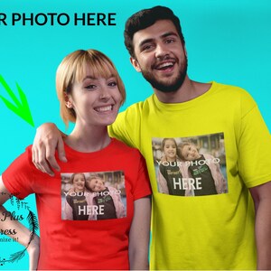 May include: Two people wearing red and yellow t-shirts with a photo of two children on the front. The text "YOUR PHOTO HERE" is printed on the shirts.