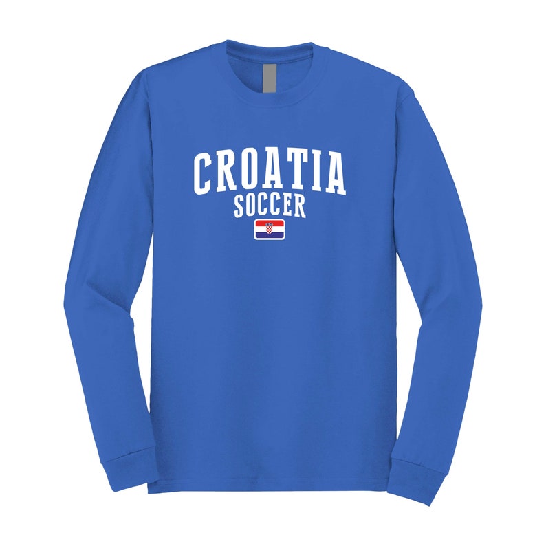May include: A royal blue long-sleeve t-shirt with the text "CROATIA SOCCER" in white and the Croatian flag printed on the shirt.