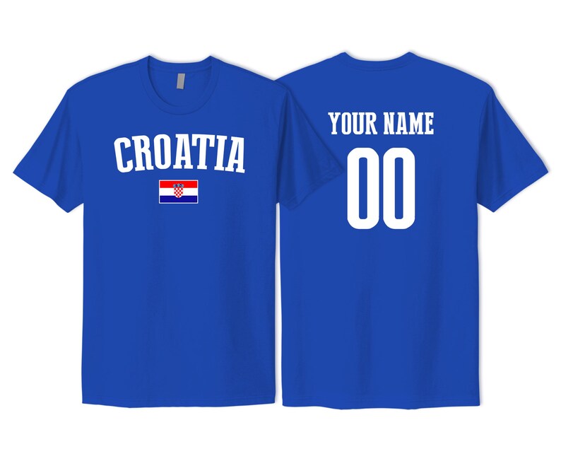 May include: A royal blue t-shirt featuring the word CROATIA in white text above a small Croatian flag on the front, and the words YOUR NAME above the number 00 in white text on the back, showcasing a customizable sports jersey design.