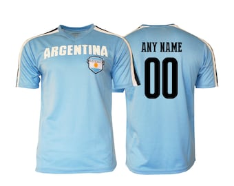 May include: A light blue soccer jersey with white accents and the word "ARGENTINA" printed on the front. The back of the jersey has a black number "00" and the text "ANY NAME" printed on it.