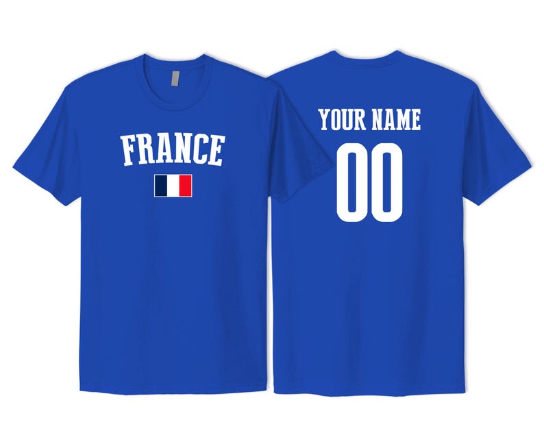 May include: A royal blue short-sleeved t-shirt featuring the word FRANCE in white capital letters above a small French flag. The back of the shirt displays the text YOUR NAME in white capital letters above the large white numbers 00.