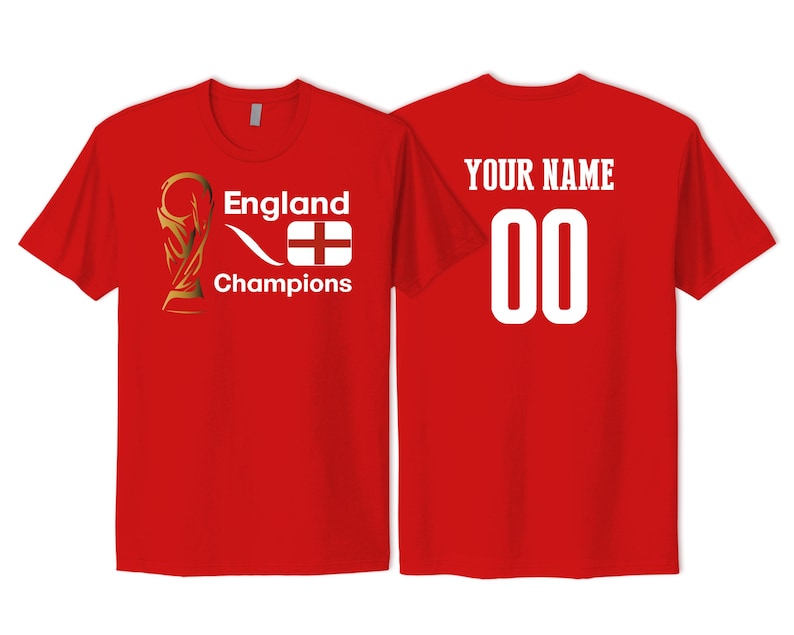 May include: A red short-sleeved t-shirt featuring a gold trophy graphic, the text England Champions, and an England flag on the front. The back of the shirt displays the text YOUR NAME above the number 00 in large white font.