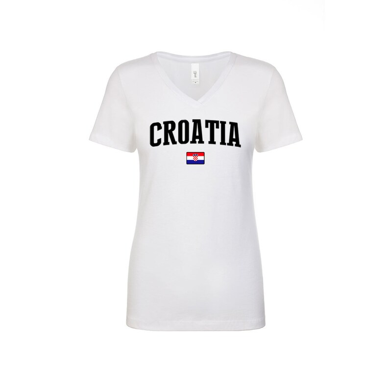 May include: White v-neck t-shirt with the word "CROATIA" printed in black letters and the Croatian flag printed below the word.