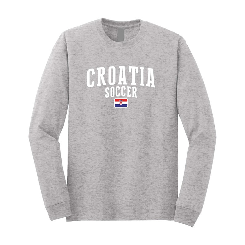 May include: A gray long-sleeve t-shirt with the text "CROATIA SOCCER" in white and the Croatian flag printed on the front.