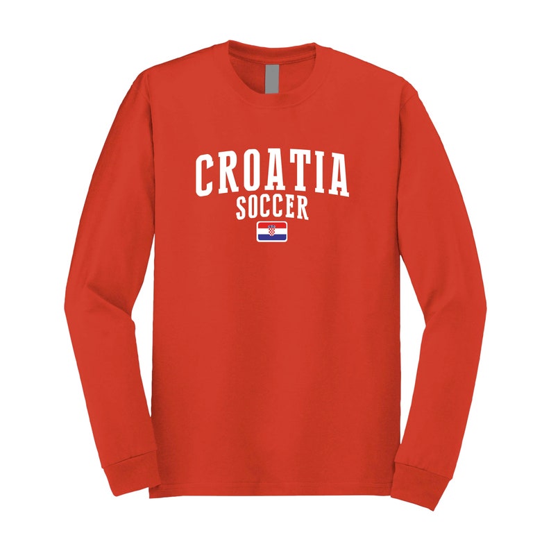 May include: Red long-sleeve t-shirt with white text that says "CROATIA SOCCER" and a small Croatian flag.