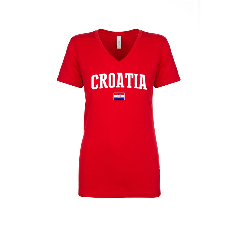 May include: Red V-neck t-shirt with the word "CROATIA" in white letters and the Croatian flag printed on the front.