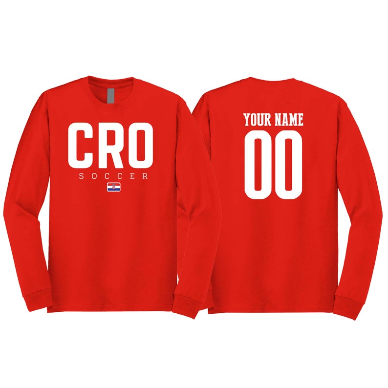 May include: Two red long-sleeve shirts. One shirt has the word "CRO" with "SOCCER" and the Croatian flag underneath. The other shirt has the text "YOUR NAME" and the number "00" in white.
