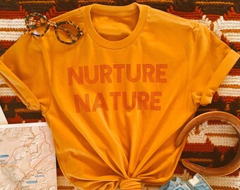 Nurture Nature Graphic Tee: Retro 70s Style, Mustard Unisex T-Shirt