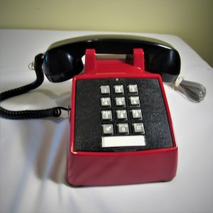 Red and Black Push Button Desk Phone