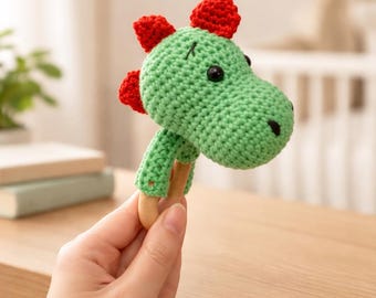 Crochet a rattle, crochet rattle instructions, crochet a dinosaur rattle, crochet an amigurumi rattle, crochet an animal rattle, crochet a rattle with a wooden ring