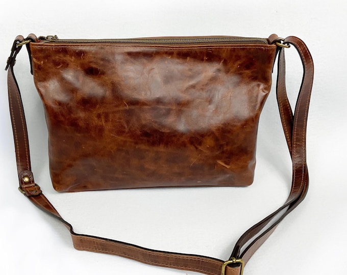 Brown pull-up leather, medium crossbody bag for women with rustic full grain leather.