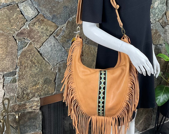 Large tan leather fringe bag, western shoulder bag and crossbody bag.