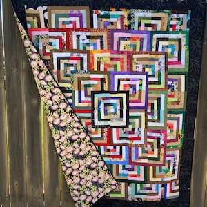 Scrappy half log cabin quilt
