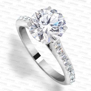 Round Brilliant 1.00 ct Engagement Ring with Cathedral 0.32 ctw Diamond Band. LR7340