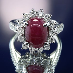 3.00 ct Oval Cut Ruby & 0.94 ctw Diamond Halo Ring. LR6621