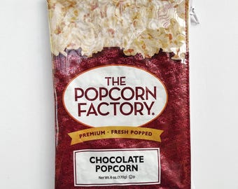 170g Chocolate Popcorn Bag from the USA. Our zippered bags are fabric lined and covered in a durable PVC.