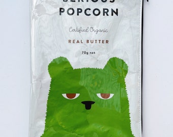 70g Real Butter Popcorn Bag from New Zealand. Our zippered bags are fabric lined and covered in PVC.