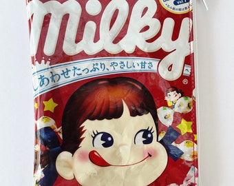 120g Milky Confectionery Bag from Japan. Our zippered bags are fabric lined and covered in PVC.
