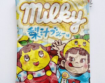 76g Milky Confectionery Bag from Japan. Our zippered bags are fabric lined and covered in PVC.