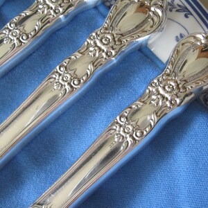 May include: A set of three ceramic mugs with a speckled, matte finish. The mugs are in shades of cream, light gray, and dark gray. Each mug has a simple, minimalist design, perfect for coffee or tea.