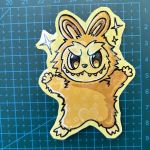 24 karot gold labubu sticker