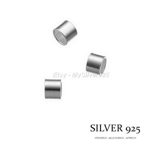 May include: Three silver 925 crimp beads, used for jewelry making.